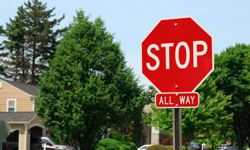 stop sign at or on the line mistake of law